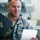 Lieutenant Colonel Jimmy Schlabach shows off a floppy disc used in the launch control center at the F.E. Warren Air Force Base for a Seeker video